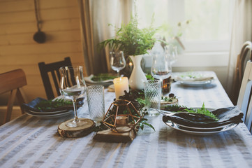 summer table setting in natural organic style with handmade details in green and brown tones. Country living concept