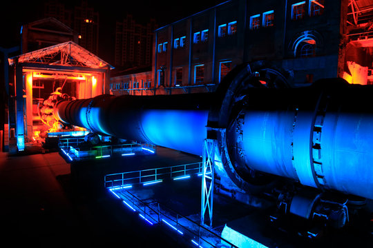 idle cement plant rotary kiln machinery at night