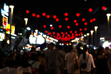 Naklejka premium Blurred asian street with chinese red lantern as new year symbol.