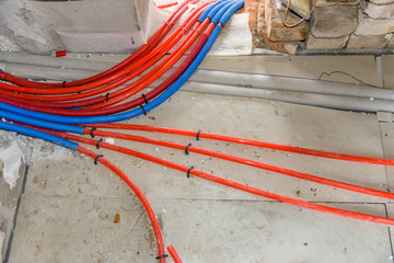 Tubes of the underfloor heating system on a styrofoam insulation