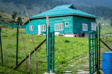An entrance leading to a tourism resort hut in Kashmir