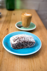 Lamingtons with a glass of coffee