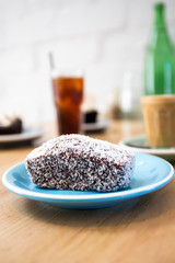 Lamingtons with a glass of coffee