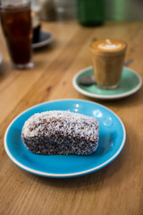 Lamingtons with a glass of coffee