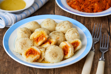 Potato dumplings stuffed with carrots on a plate    
