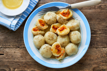 Potato dumplings stuffed with carrots on a plate    