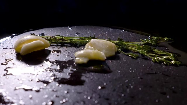 thyme and garlic grill on a pan with olive oil