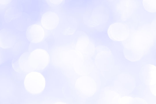 A brilliant blurry background of blue. Template for a holiday greeting card and labels with a pattern of circles with neon glitter.