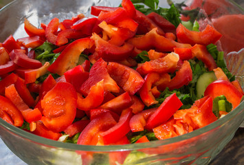 salad from fresh vegetables in a plate on a table,