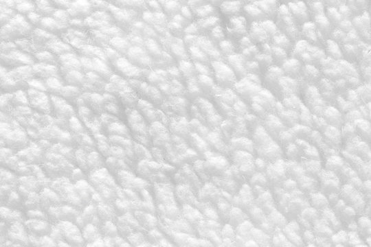 White sheep fur with a texture of fibers. Pattern soft canvas for various purposes.