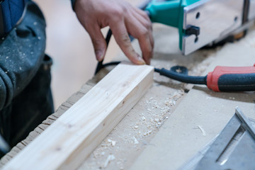 Technician handles a variety of woodworking tools to make wooden products. Both hand and machine tools are used after carpenters measure exact size by different types of rulers.