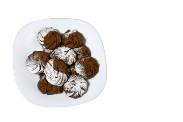 Pile of chocolate chip cookies on a dish isolated on white background