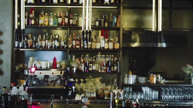 Blurred bar counter with fly camera move and film look colors