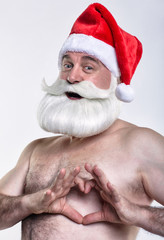 Naked santa claus shows fingers heart sign and congratulations on Valentine's Day
