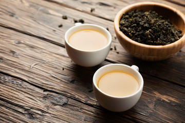 Obraz na płótnie Canvas Two cups with hot green tea
