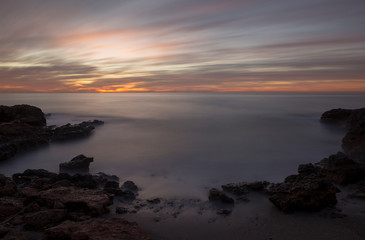 Fototapeta na wymiar The coast at dawn in long exposure, Oropesa