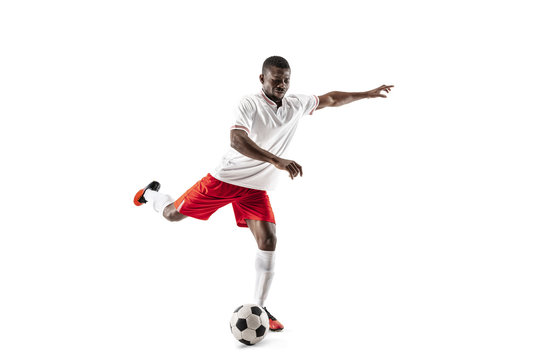 Professional african american football soccer player in motion isolated on white studio background. Fit jumping man in action, jump, movement at game.
