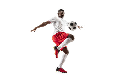 Professional african american football soccer player in motion isolated on white studio background. Fit jumping man in action, jump, movement at game. - Powered by Adobe