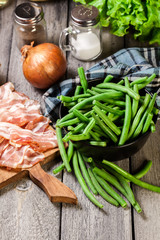 Ingredients for preparing green bean wrapped in bacon