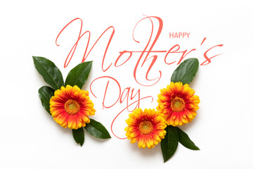 Obraz premium Happy Mother's Day Background. Flat lay greeting card with beautiful gerbera flowers on white background.
