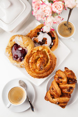 Breakfast setup with Danish pastries and coffee