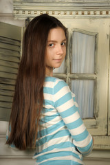 Beautiful brunette teen. Barefoot, blue.