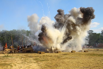 Massive bomb explosion during re-enactment of medieval battle. Blowing up on the battlefield with...