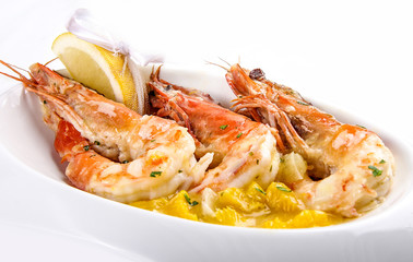 King prawns with wine sauce on white background