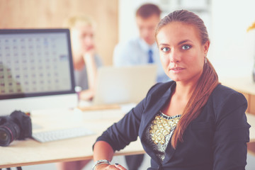 Portrait of an attractive young businesswoman sitting in front of a computer.businesswoman .