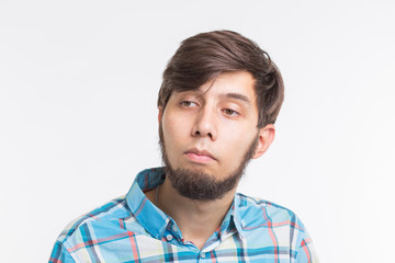 Process, problem, people concept - young man thinking about something on white background