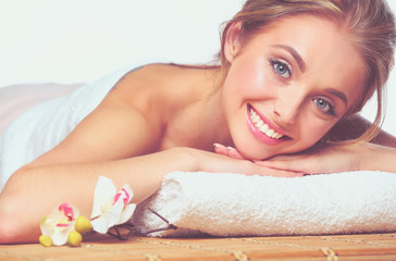 Obraz na płótnie Canvas Closeup of an attractive young woman receiving massage .