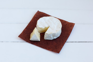 Camembert cheese traditional Normandy French gourmet round dairy product delicious food on rustic...