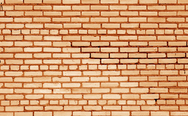 Fototapeta premium Old brick wall surface in orange tone.