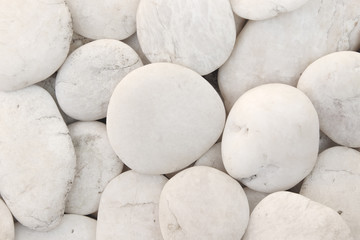 Fototapeta na wymiar Close up natural white pebbles, texture of decorative stone gravel for background and design.
