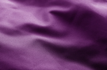 Textile texture with blur effect in purple color.