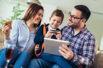 Family doing online shopping with tablet