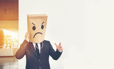 Businessman masked stress on the company stairs.
