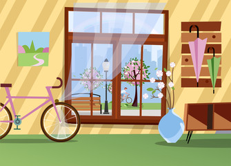 Obraz premium Window with view of blooming trees in city park. Spring warm interior with bicycle, branches in vase, table in hallway and umbrellas on hanger. Silhouette of big city outside. Flat cartoon vector