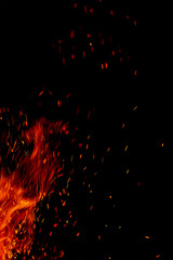 Fototapeta na wymiar flame of fire with sparks black background