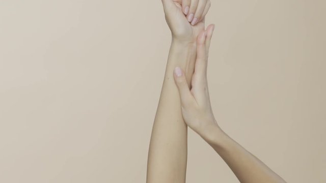 Feminine hands on a beige background, recorded on Red Monstro using the Briese Focus 140 HMI light.