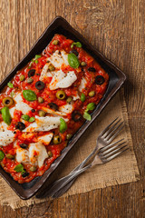 Cod in Italian in tomatoes with olives and capers.