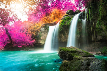 Fototapeta na wymiar Amazing in nature, beautiful waterfall at colorful autumn forest in fall season 