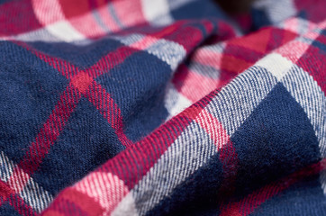 Macro photo of fabric pattern, close up of textile clothing with shallow depth of field