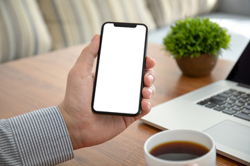male hands holding phone with isolated screen in the office
