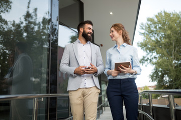Business partners workmate couple talking in an urban city