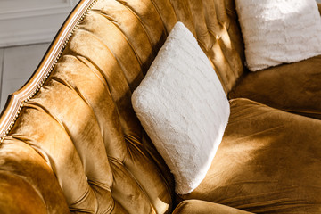 Interior design with white pillows on brown sofa, close up topview