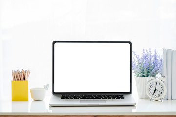 Fototapeta na wymiar Mockup laptop with blank screen on white table.