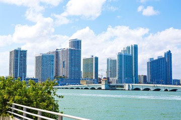 Miami, Florida, USA downtown skyline. Building, ocean beach and blue sky. Beautiful city of United...