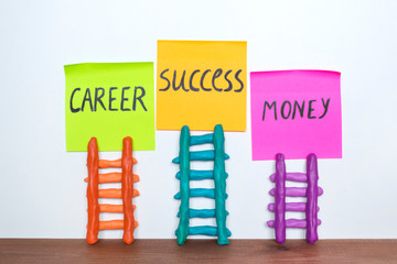 Plasticine ladder and words Career, Success, Money written on paper note. 