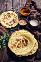 naan, indian flatbread, pita on a table